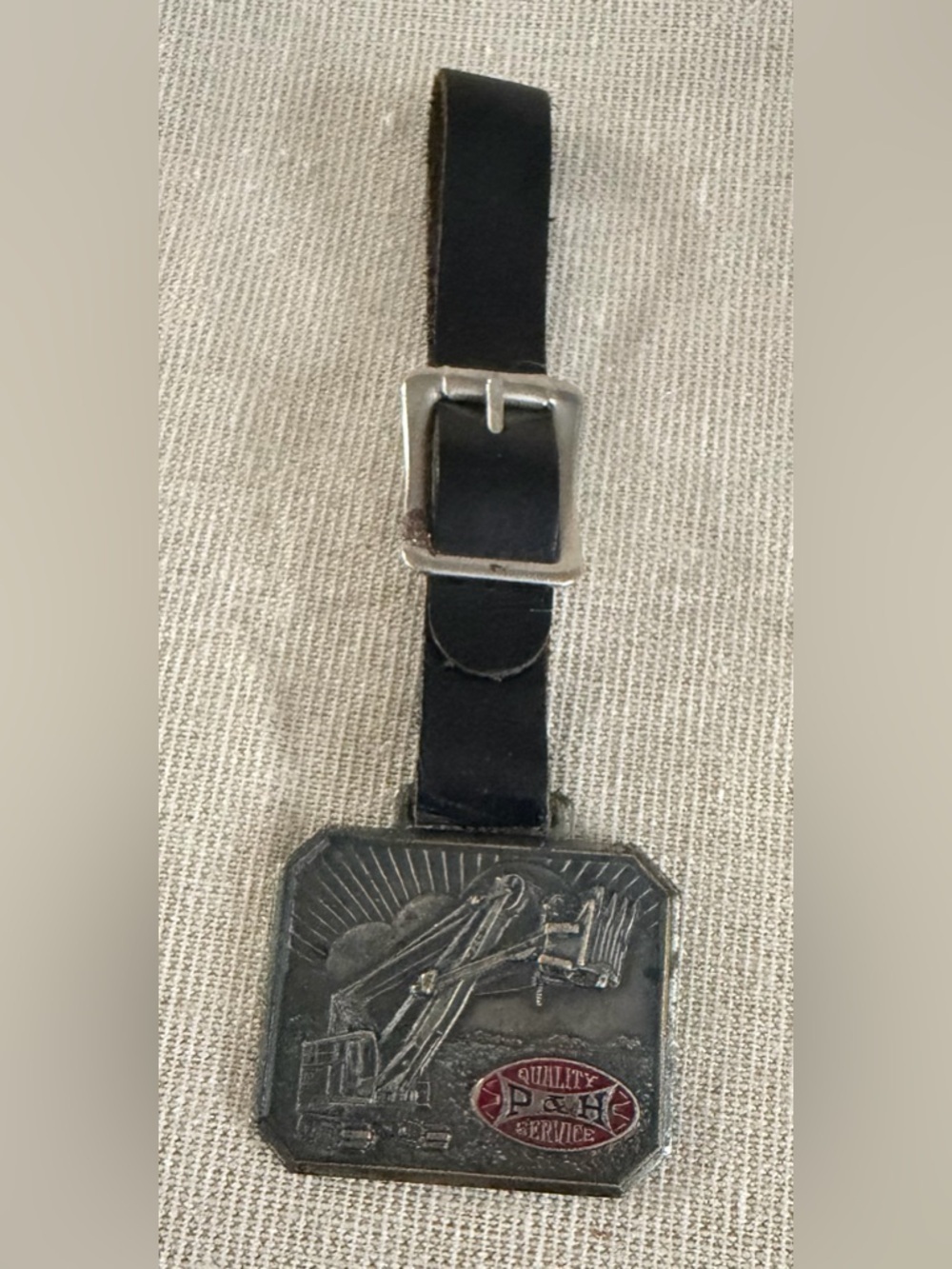 Black Leather Luggage Tag with Metal Excavator Emblem